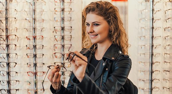 girl holding new glasses