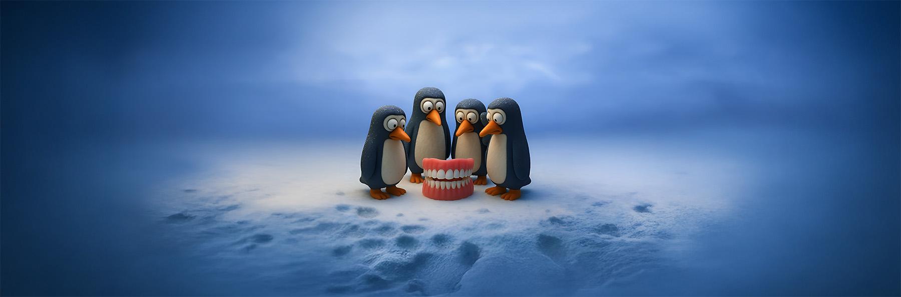 Penguins looking at a set of teeth