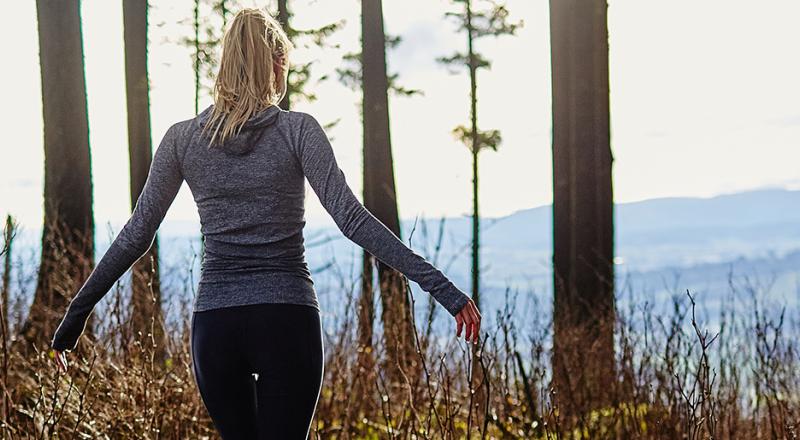 woman walking in forest