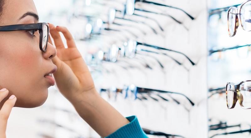 woman trying on glasses